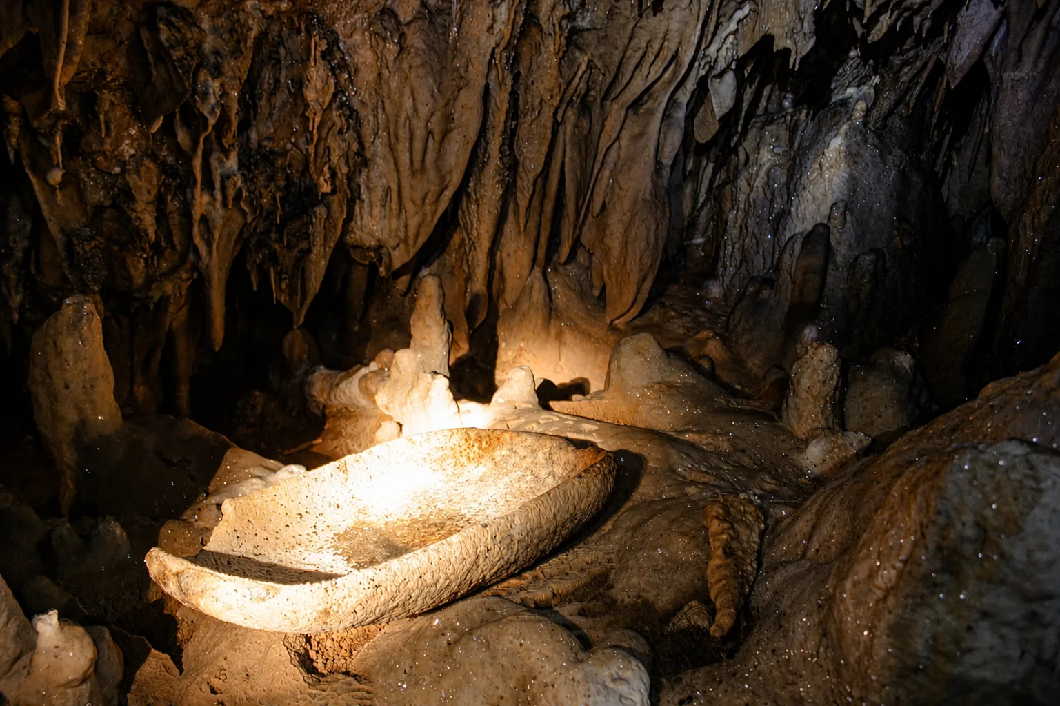 Rugged limestone formations in the interior of the ATM Cave (Actun Tunichil Muknal), Belize