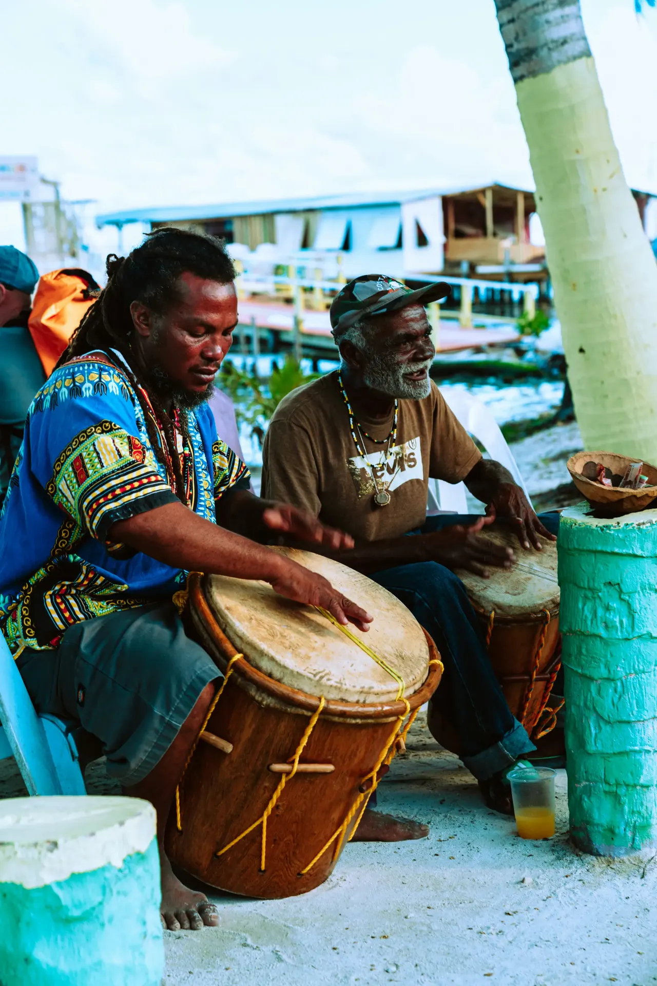 Garifuna musicians playing traditional drums on the beach in Belize
