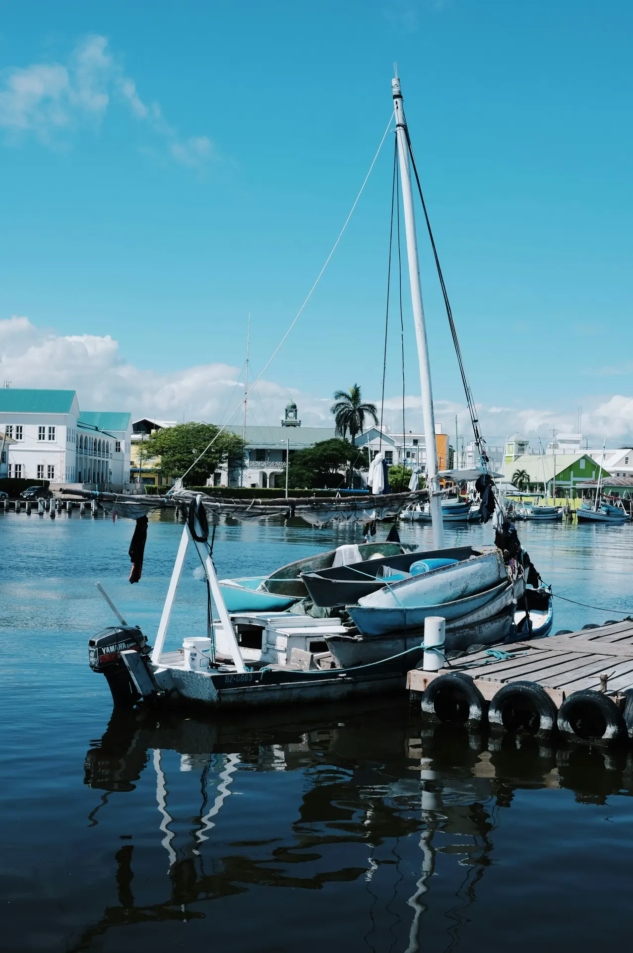 Small boat tied to a dock in Belize City