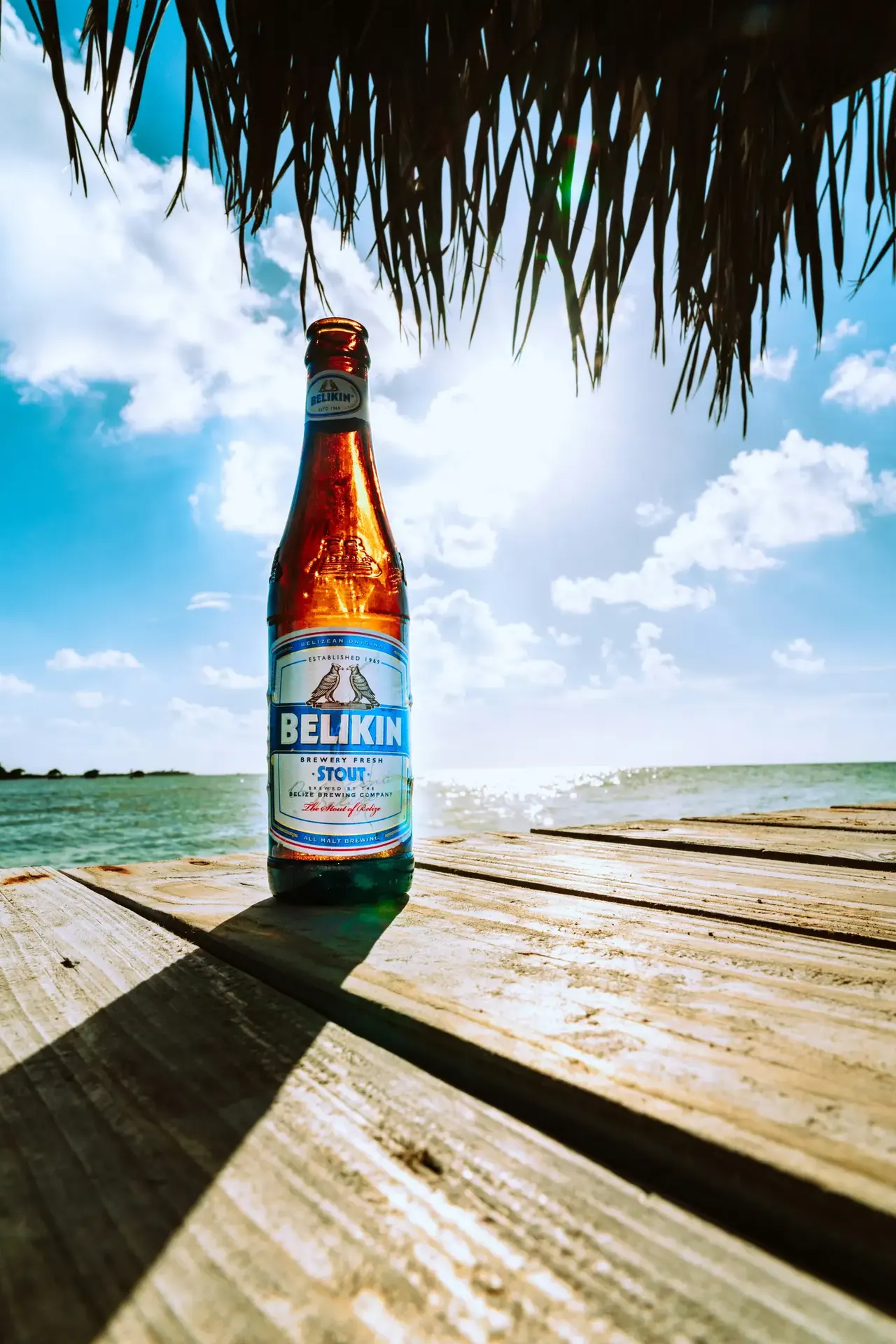 Sunny beach dock on Caye Caulker with turquoise water in Belize