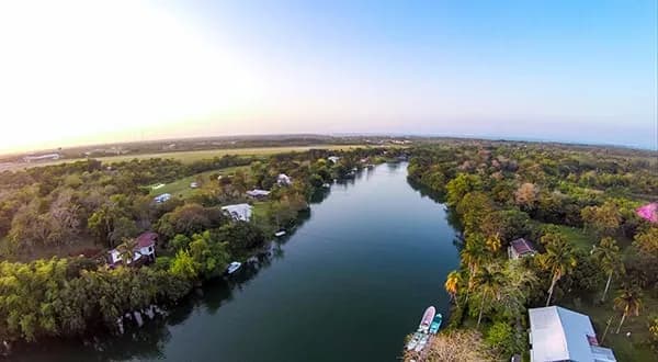 The Belize Olde River at dawn from above Belize River Lodge, looking downriver toward the Caribbean