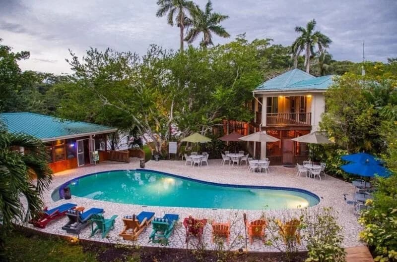 Freshwater swimming pool and patio seating area at Black Orchid Resort, Belize.