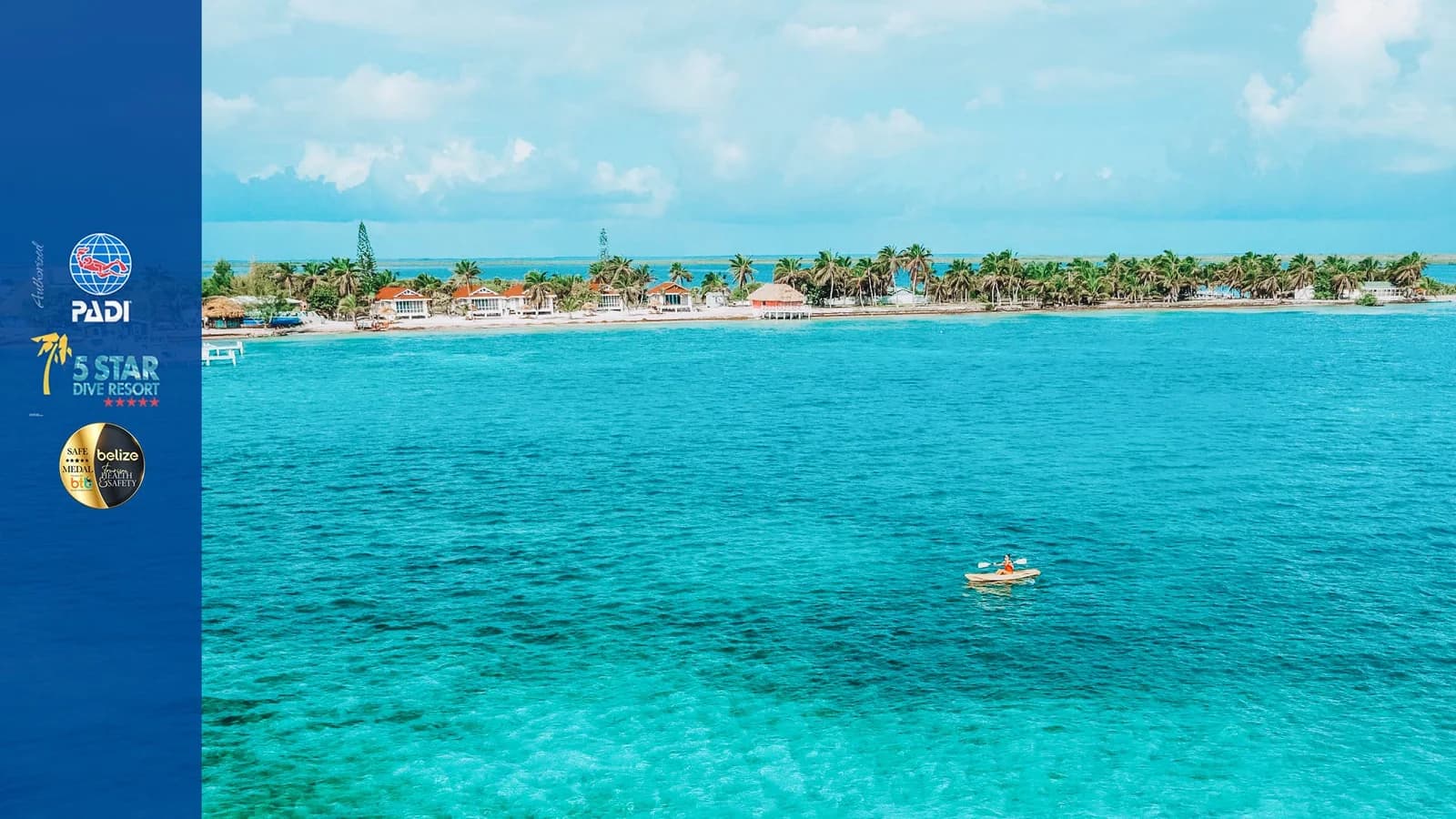 Aerial view of Blackbird Caye Resort's island and shoreline on Turneffe Atoll, Belize