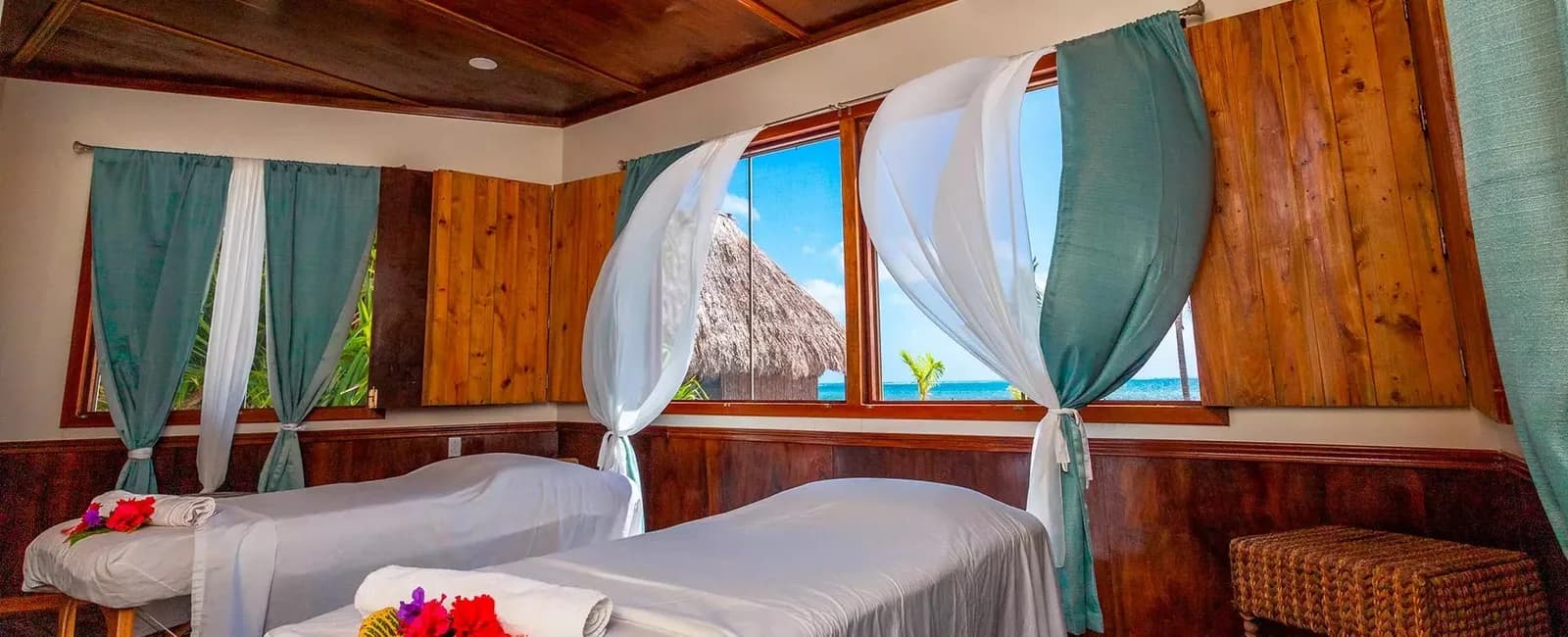 Oceanview spa treatment room with two massage beds at Captain Morgan's Retreat