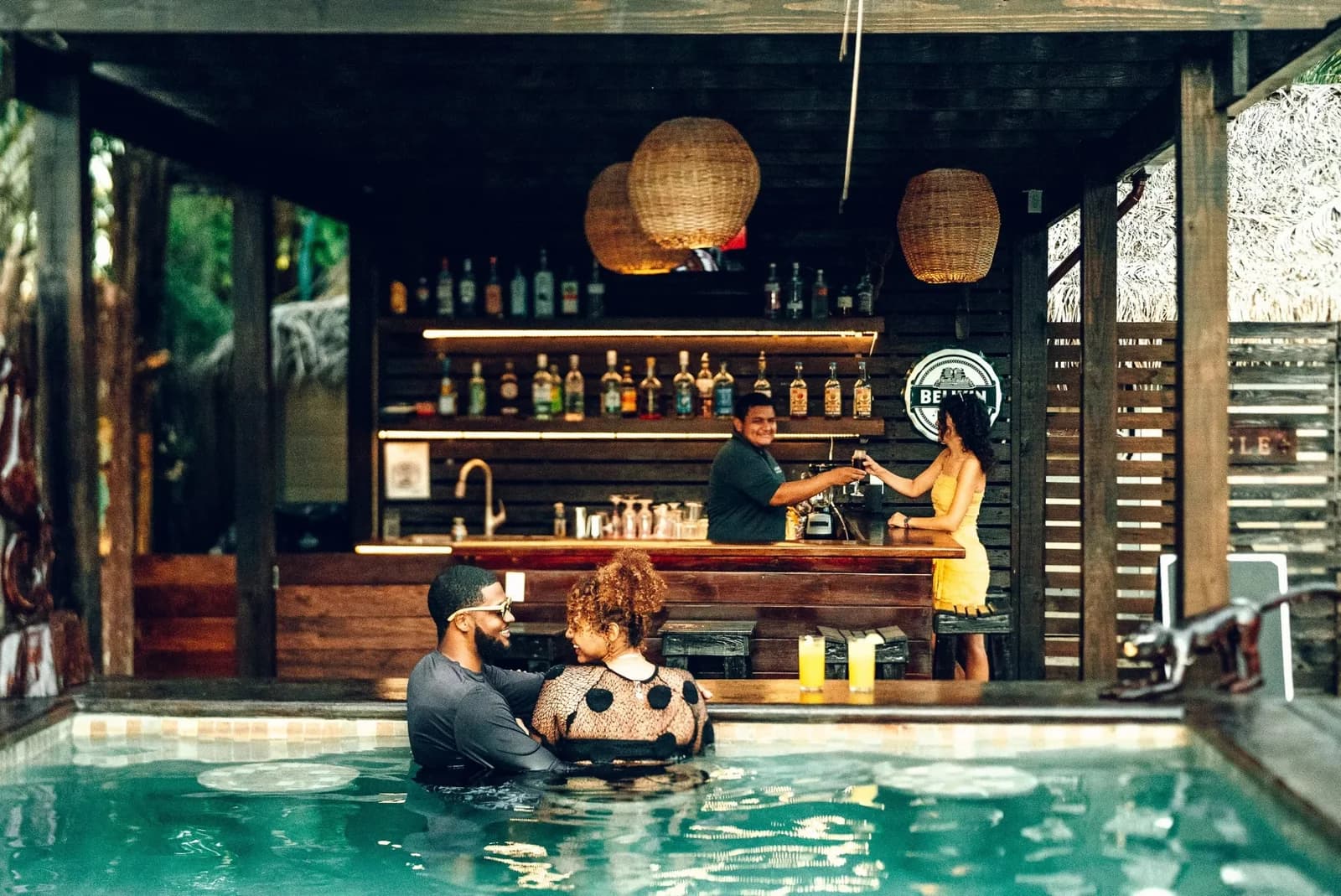 Guests enjoying drinks at La Cantina, the swim-up pool bar at Caribbean Beach Cabanas