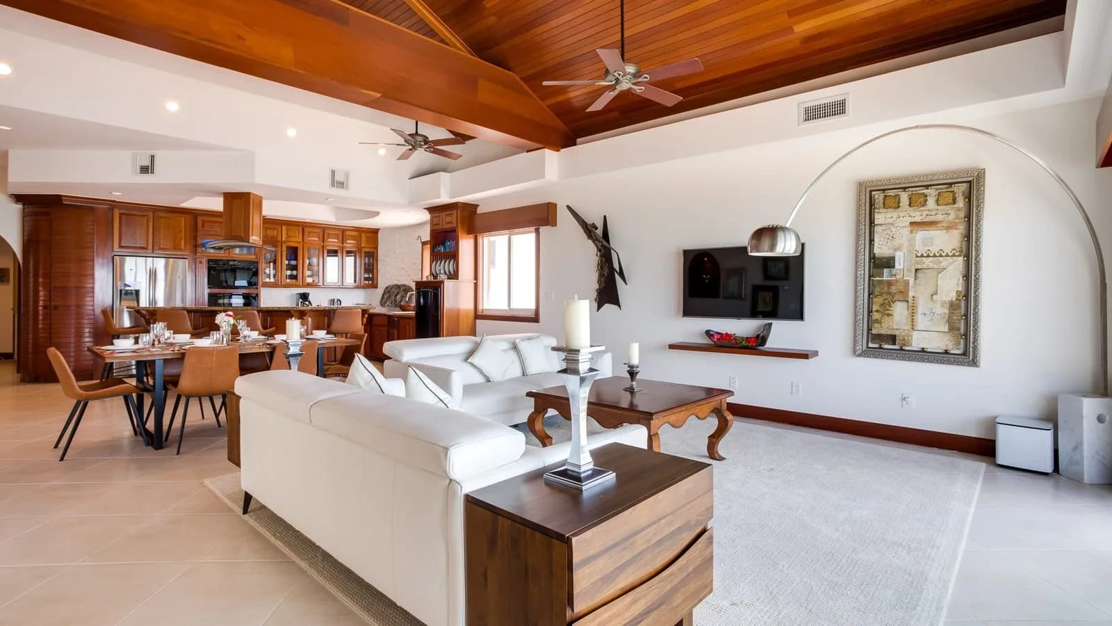 Open-plan living and dining room in a condo at Grand Caribe Belize