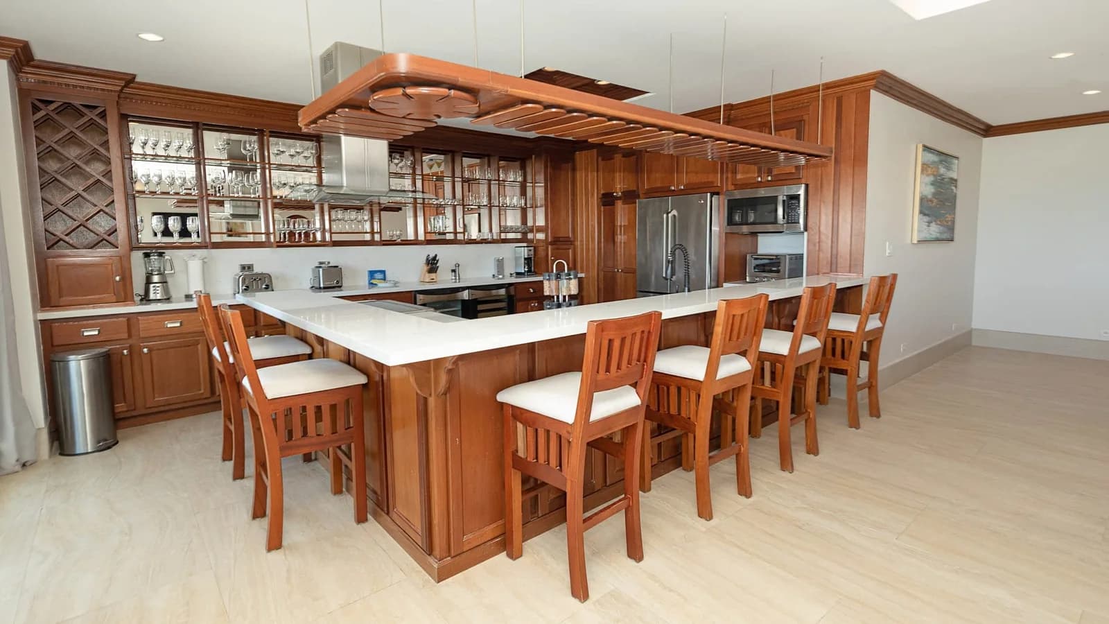 Full kitchen with breakfast bar seating in a Grand Caribe Belize condo