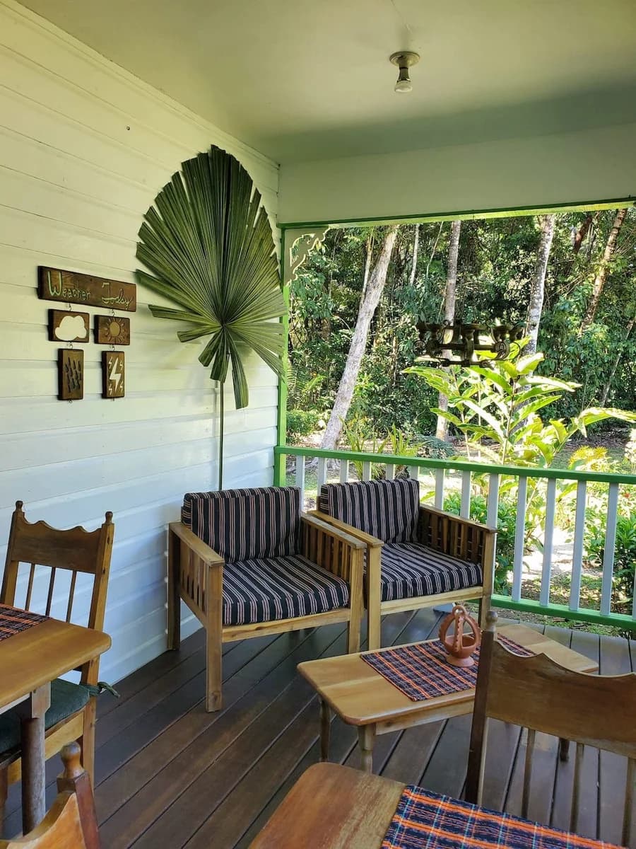 Guest lounge seating on the main house verandah at Hickatee Cottages overlooking the gardens