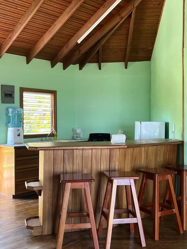 Reef house kitchenette and bar seating area at Isla Marisol Resort