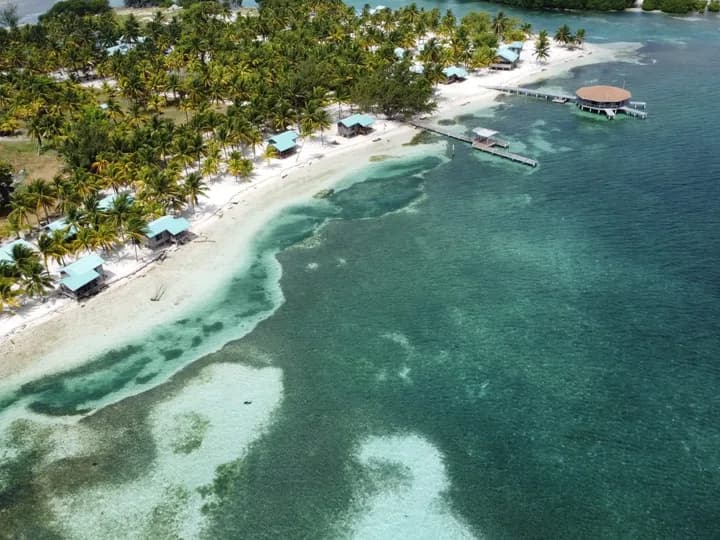 Belize travel scene featuring Isla Marisol Resort in Glover's Reef Atoll