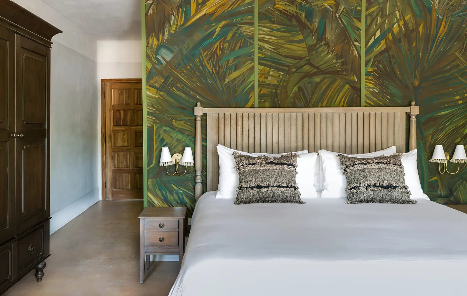 Elegant bedroom with tropical decor at Itz'ana Belize Resort & Residences, Placencia, Belize