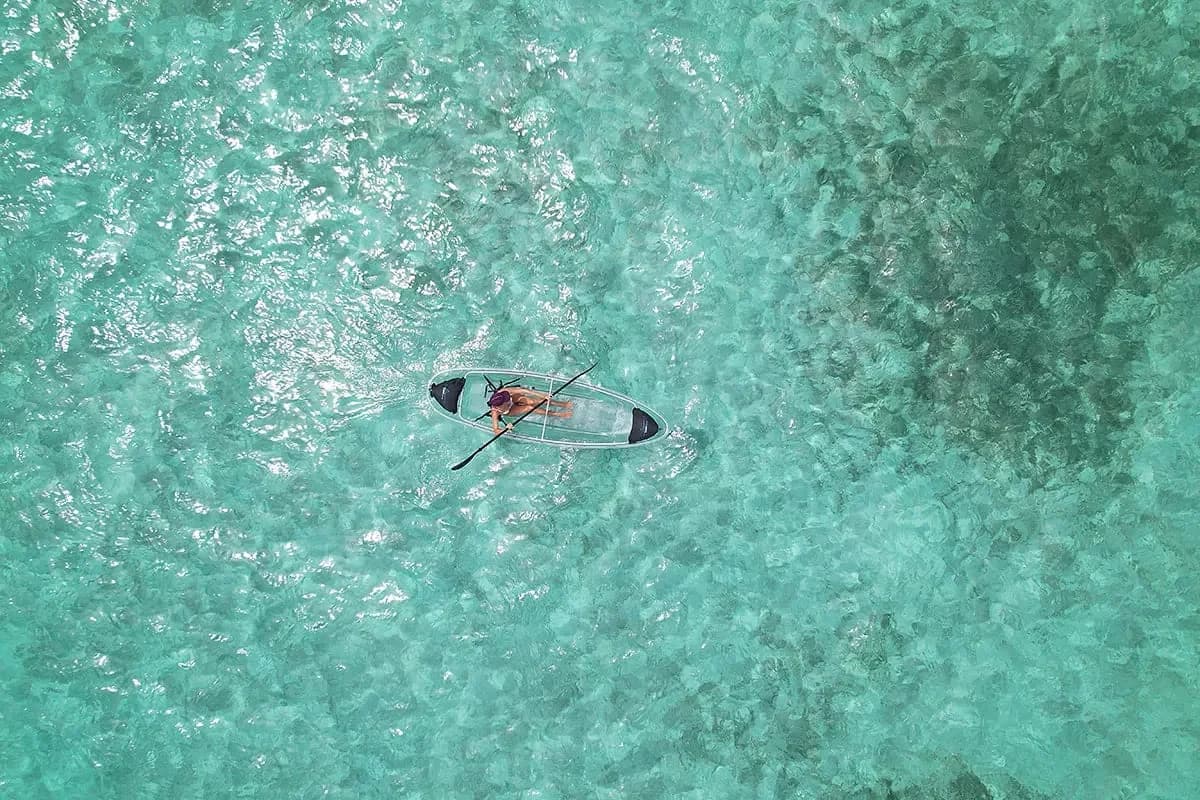 Wooden dock extending over turquoise water at Las Terrazas Resort, Ambergris Caye, Belize