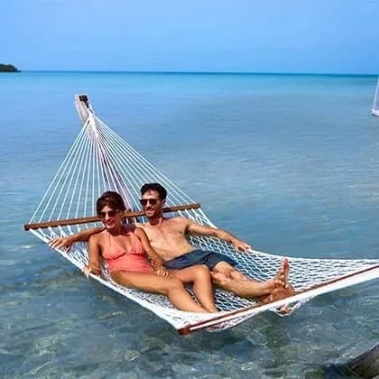 Overwater hammocks at the private Beach Club, Mahogany Bay Resort, Ambergris Caye, Belize