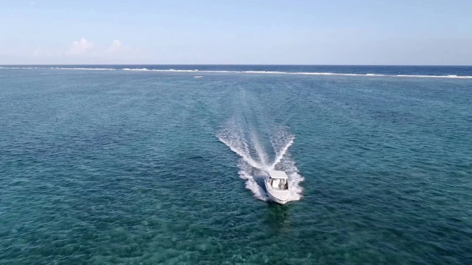 A boat crossing the reef off Matachica Resort and Spa, North Ambergris Caye, Belize