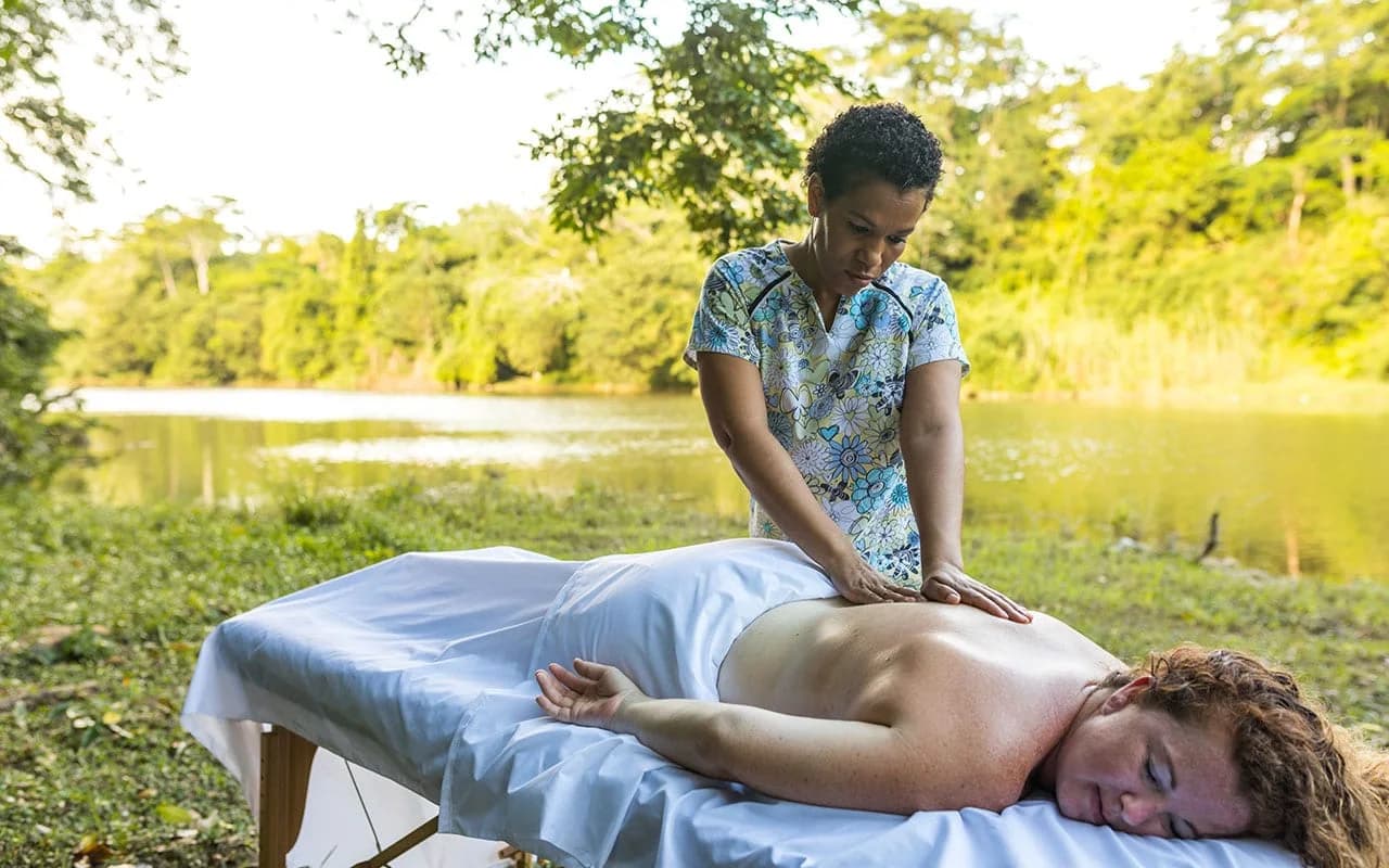 Outdoor spa massage treatment at Midas Belize overlooking the riverside nature reserve