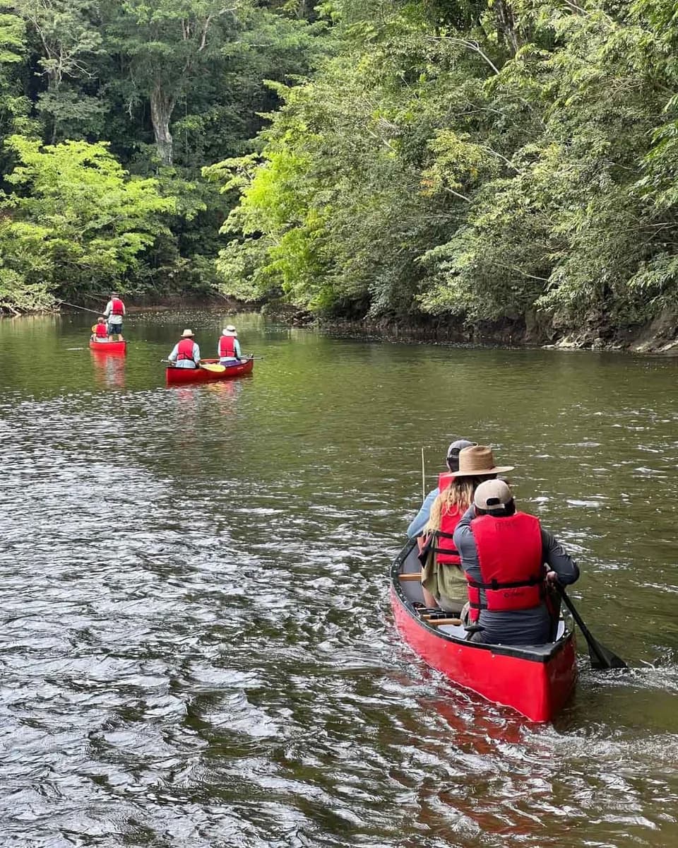 Guests canoeing down the Macal River near Mystic River Resort in Cristo Rey