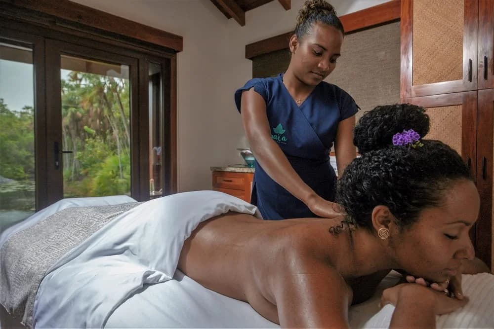 Spa massage treatment in a garden-view treatment room, Naia Resort and Spa, Placencia, Belize