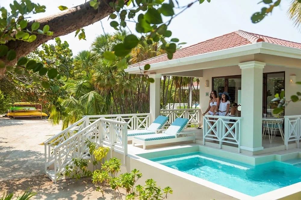 Beach house exterior with private plunge pool and lounge chairs, Naia Resort and Spa, Placencia, Belize