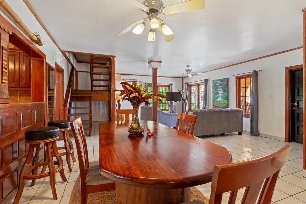 Living and dining area inside a Portofino Mansion unit at Portofino Beach Resort