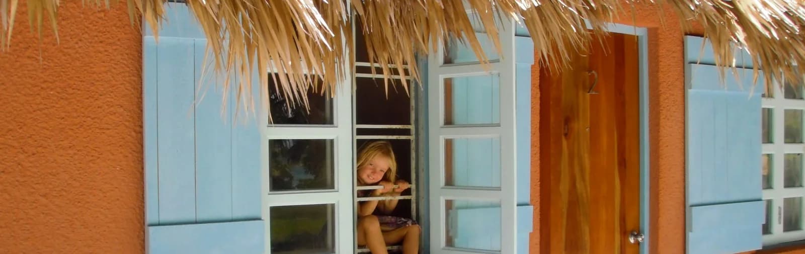 Artisan touches in the tree-covered courtyard at the family-run Sea Dreams Hotel, Caye Caulker