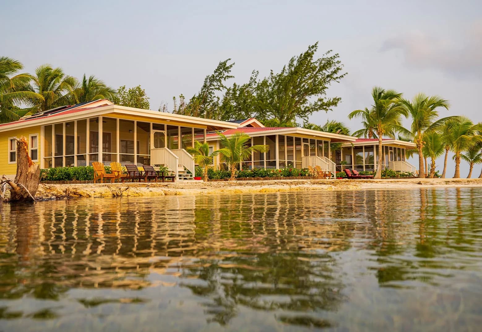 Row of Sunset Villas along the shoreline at Turneffe Island Resort, Belize