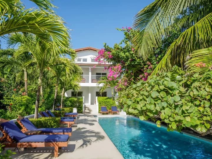 Belize travel scene featuring Weezie's Ocean Front Hotel and Garden Cottages in Caye Caulker